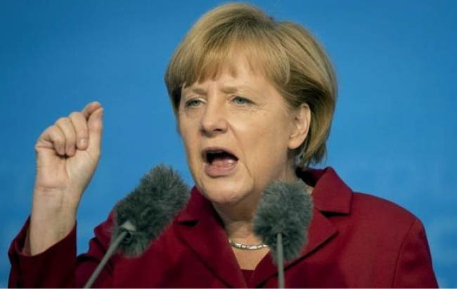 Merkel Sticks to Migrant Course  After German State Elections